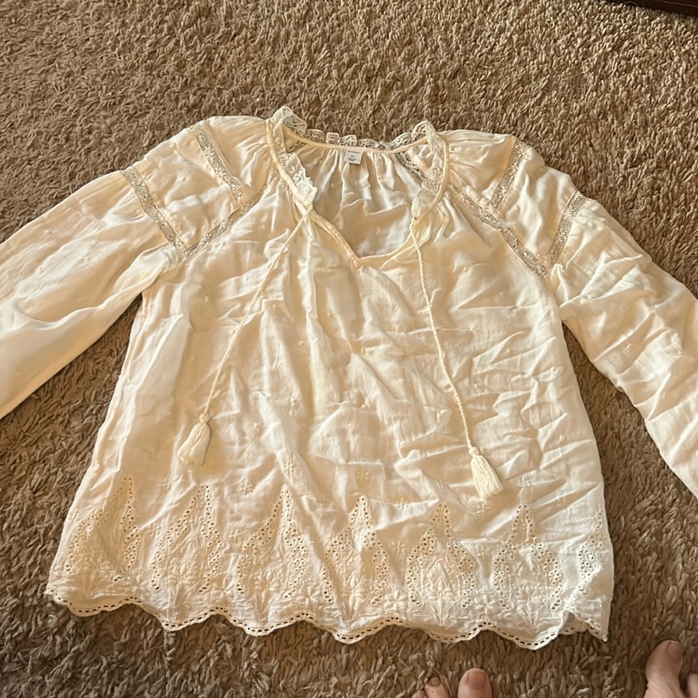 Beige women’s blouse.lace around neck with longer tassels. Long sleeve